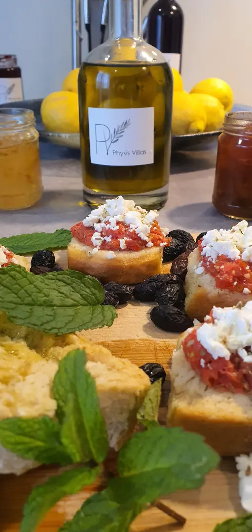 Cretan Mediterranean welcome basket with rusks, tomatoes, olive oil and homemade jams at Physis Villas