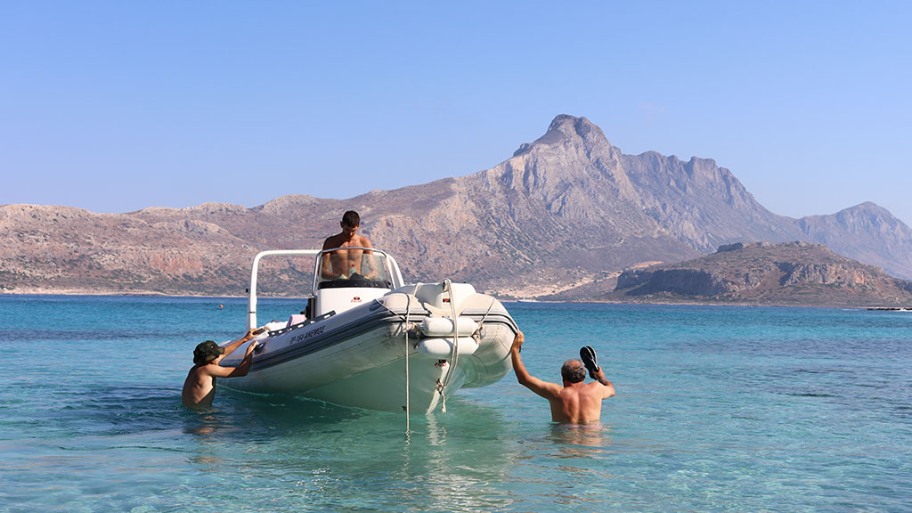 Sailing boat on the crystal blue waters of Crete