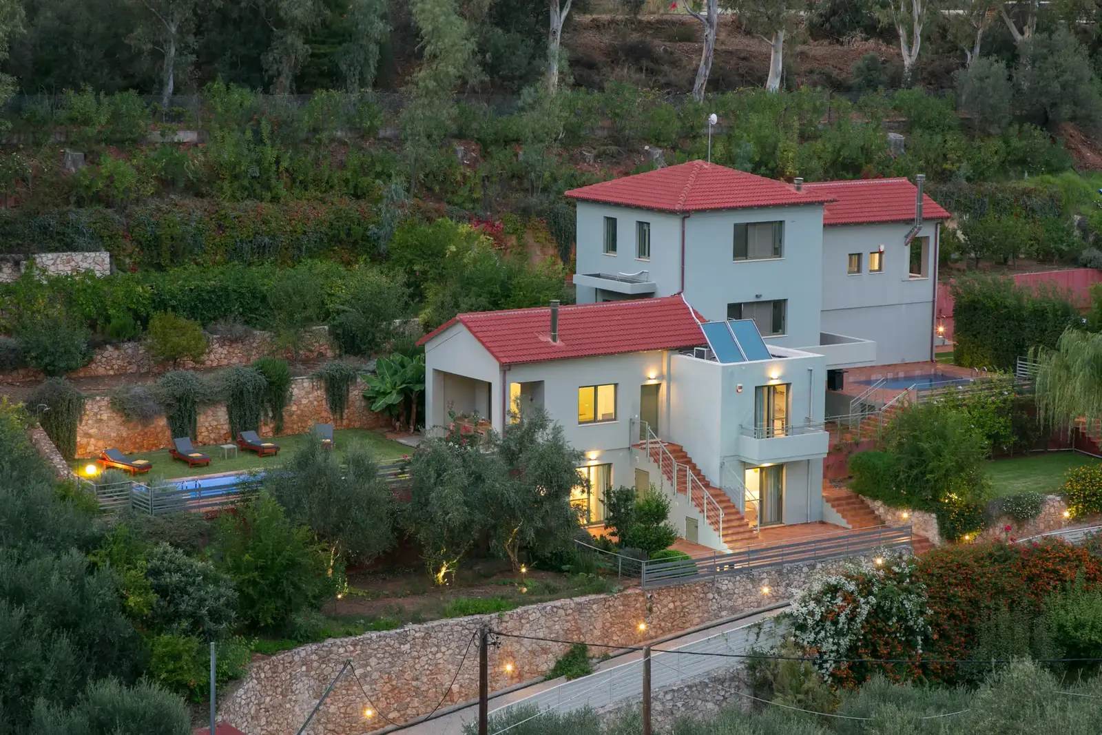 Aerial view of the Physis Villas estate among olive groves at dusk, Agia Chania Crete
