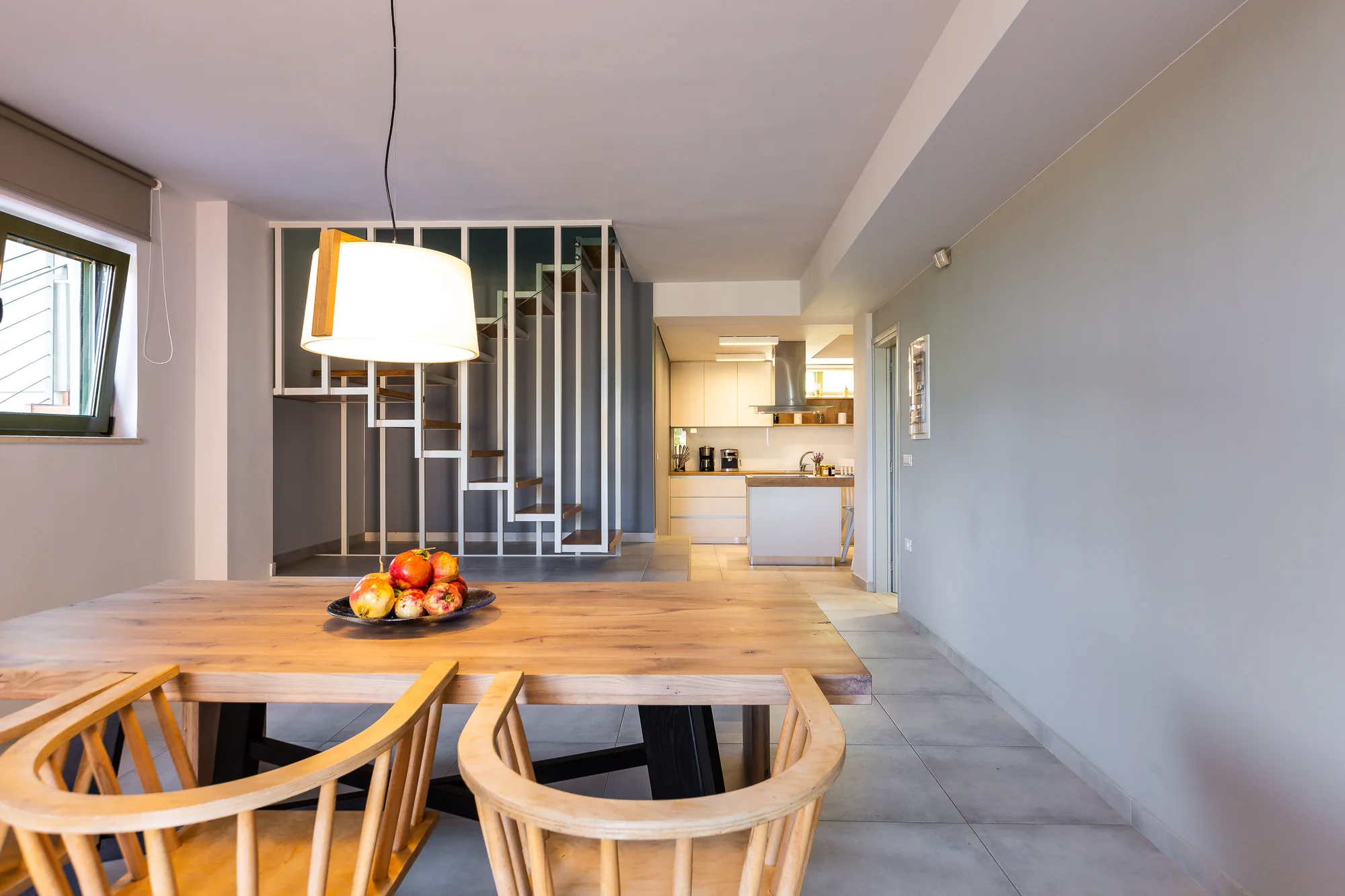 Dining area and floating staircase at Villa Erato, Physis Villas Chania