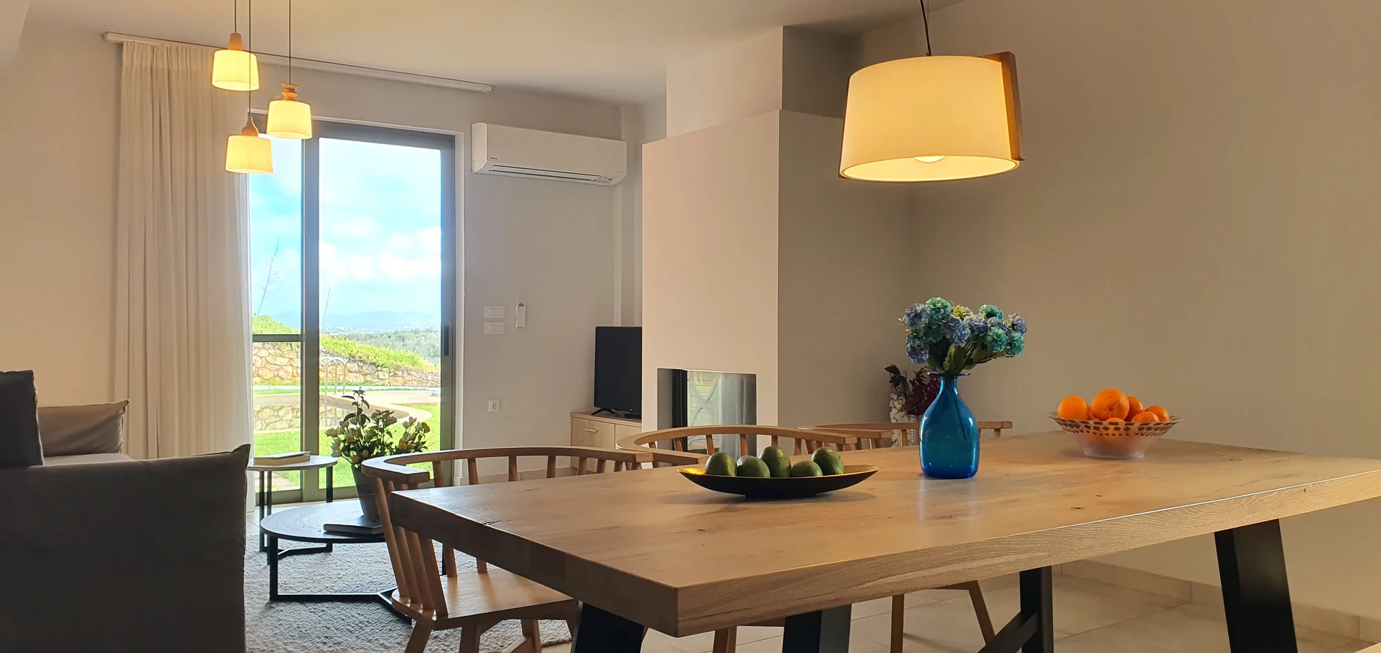 Oak dining table beside the terrace doors at Villa Erato, Physis Villas Chania