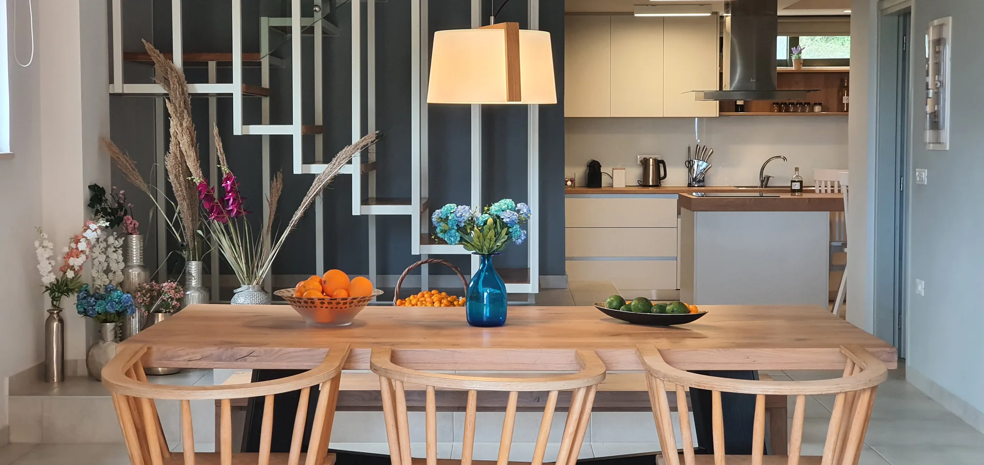 Fully equipped kitchen with breakfast bar and open shelving at Villa Erato, Physis Villas Chania