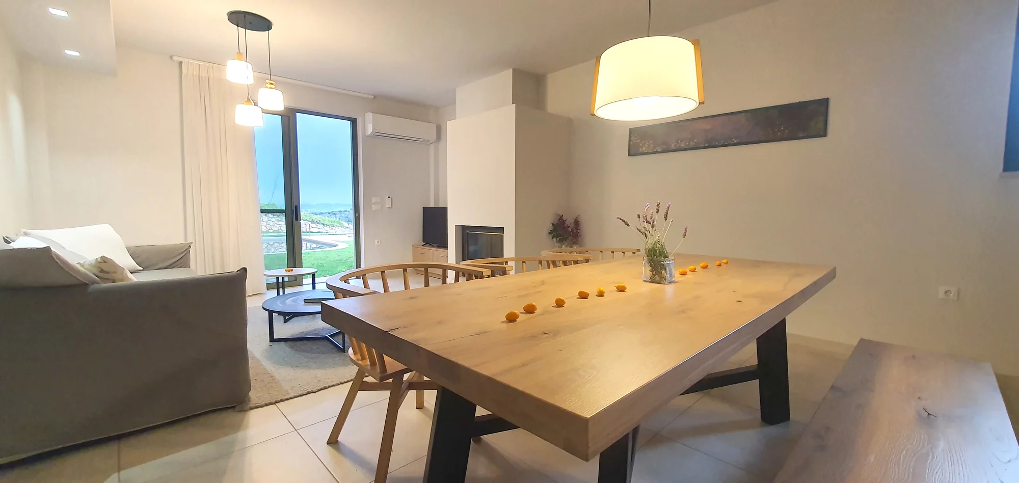 Villa Erato living room with fireplace, dining table and countryside view, Chania